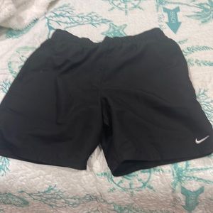 Black Nike athletic shorts.